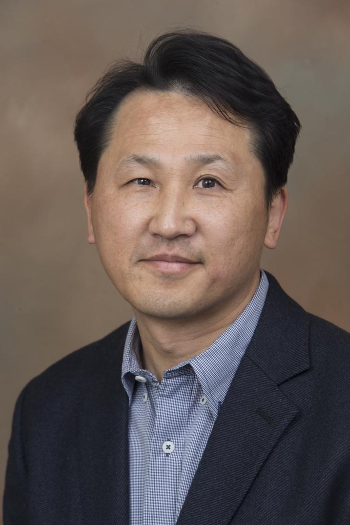 Dr. Kwan Yi